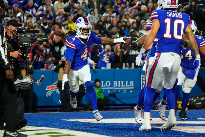 James Cook (4) celebrating after scoring a touchdown in the Bills' 31-10 win over the Cowboys.